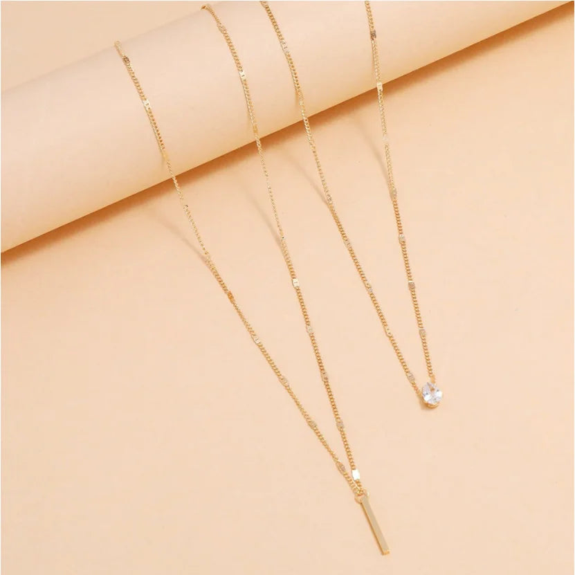 Collier double rang en acier avec pendentif goutte en zircon